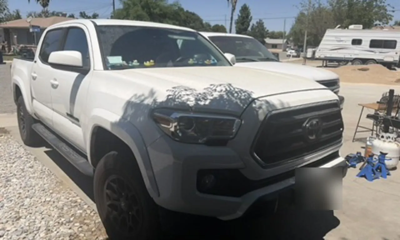 Anthony Limpert's white Toyota Tacoma